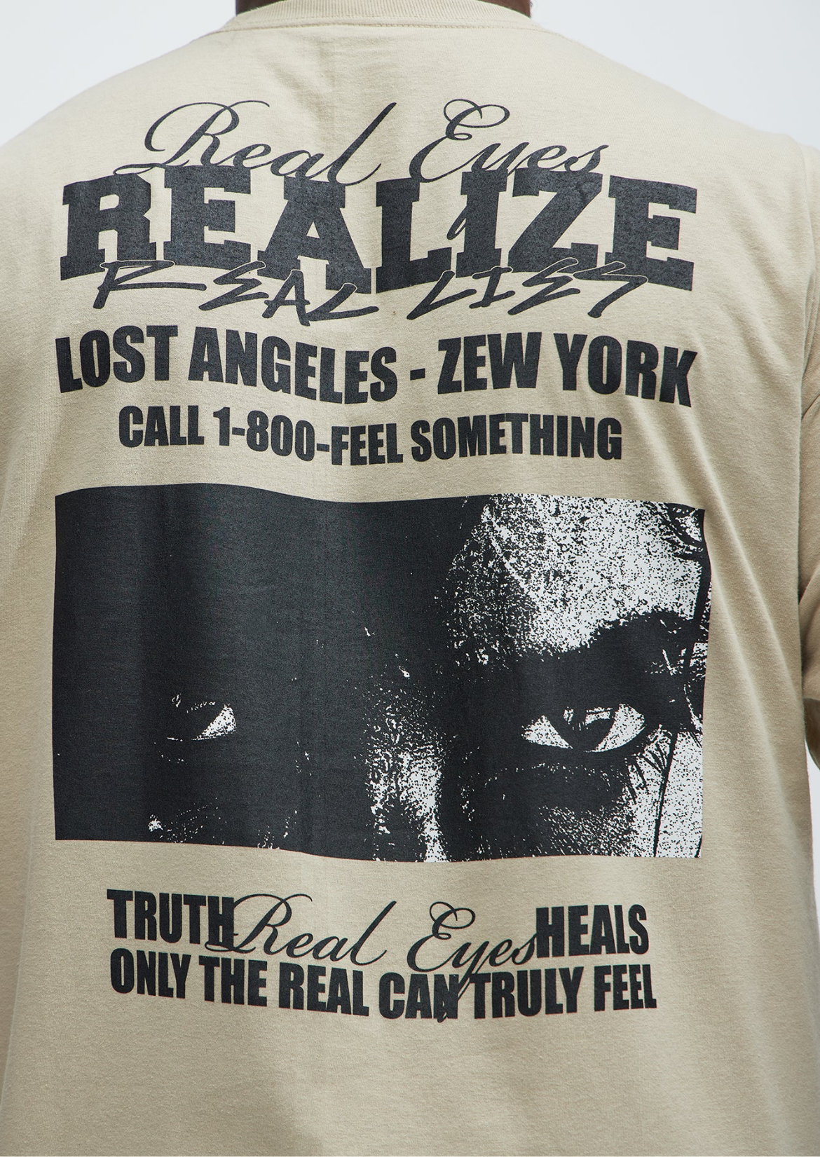 Real Eyes Realize Real Lies Tee- Sand